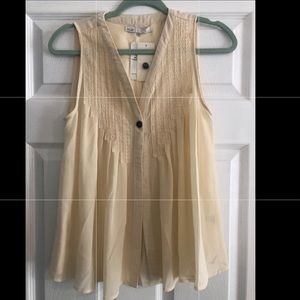 In love, size small, beige tank